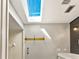 Bright, airy bathroom with skylight, shiplap wall, updated fixtures and walk-in shower at 1494 Grace Lake Cir, Longwood, FL 32750