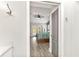 Light and airy bedroom with gray color scheme is enhanced by wood floors and large doorway at 1494 Grace Lake Cir, Longwood, FL 32750