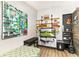 Bedroom with artistic decor, wood-look floors, shelving, and a large colorful painting on the wall at 1494 Grace Lake Cir, Longwood, FL 32750
