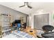 This cozy bedroom features shelving, a ceiling fan, closet, and fun decor at 1494 Grace Lake Cir, Longwood, FL 32750