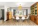 Dining room with wood-look floors, gray walls, and rustic furnishings and decor at 1494 Grace Lake Cir, Longwood, FL 32750