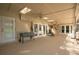 Open patio features neutral tiling, ceiling fans, skylights, and multiple entrances at 1494 Grace Lake Cir, Longwood, FL 32750