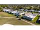 Golf community aerial featuring well-maintained homes and scenic green golf paths at 1510 E Schwartz Blvd, The Villages, FL 32159