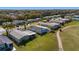 Birds-eye view of the home in a quiet neighborhood setting and convenient golf course access at 1510 E Schwartz Blvd, The Villages, FL 32159