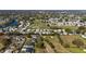 Extensive community aerial featuring golf course, lake, and various residential streets at 1510 E Schwartz Blvd, The Villages, FL 32159