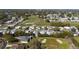 Community aerial showcasing homes within a golf course setting at 1510 E Schwartz Blvd, The Villages, FL 32159