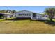 Beautiful backyard featuring a serene patio area, perfect for relaxation and outdoor enjoyment at 1510 E Schwartz Blvd, The Villages, FL 32159