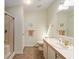 Bathroom featuring a tiled floor, shower and vanity at 1510 E Schwartz Blvd, The Villages, FL 32159