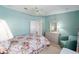 Comfortable bedroom with a ceiling fan, carpet, and dresser at 1510 E Schwartz Blvd, The Villages, FL 32159