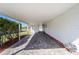 Carport with brick pavers and a covered area, providing protection and convenience for vehicles at 1510 E Schwartz Blvd, The Villages, FL 32159