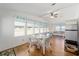 Spacious dining area with large windows and hardwood floors at 1510 E Schwartz Blvd, The Villages, FL 32159