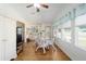Bright dining area with hardwood floors and view into the backyard at 1510 E Schwartz Blvd, The Villages, FL 32159