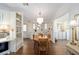 Bright dining area with hardwood floors and a chandelier at 1510 E Schwartz Blvd, The Villages, FL 32159
