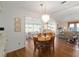 Dining area with hardwood floors and view into other rooms at 1510 E Schwartz Blvd, The Villages, FL 32159