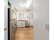Modern kitchen with stainless steel appliances, sleek countertops, and a convenient layout at 1510 E Schwartz Blvd, The Villages, FL 32159