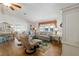 Cozy living room with wood floors, stylish furniture, and bright natural light at 1510 E Schwartz Blvd, The Villages, FL 32159