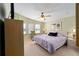 Comfortable bedroom with a ceiling fan, carpet, and soft colors at 1510 E Schwartz Blvd, The Villages, FL 32159