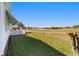 Expansive backyard featuring a well-manicured lawn and a patio with scenic views of the golf course at 1510 E Schwartz Blvd, The Villages, FL 32159