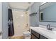 This is a bathroom with a shower and tub combination and a black framed mirror at 15475 Camp Dubois Cres, Winter Garden, FL 34787