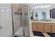 Bright bathroom featuring a double sink vanity, and glass-enclosed shower at 15475 Camp Dubois Cres, Winter Garden, FL 34787