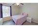 Cozy bedroom with a pink bed, bright window, and luxury vinyl flooring at 15475 Camp Dubois Cres, Winter Garden, FL 34787