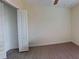 This light-filled bedroom with light gray flooring has a closet and modern decor at 15475 Camp Dubois Cres, Winter Garden, FL 34787