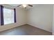 An empty bedroom with luxury vinyl flooring and a bright window at 15475 Camp Dubois Cres, Winter Garden, FL 34787