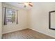 Bedroom with natural light, a window view, and a sleek mirror at 15475 Camp Dubois Cres, Winter Garden, FL 34787