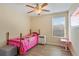 Cozy bedroom with a bright window and luxury vinyl flooring at 15475 Camp Dubois Cres, Winter Garden, FL 34787