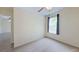 An empty bedroom with luxury vinyl flooring and a bright window at 15475 Camp Dubois Cres, Winter Garden, FL 34787
