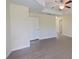 Neutral empty room with wood floors and lots of natural light at 15475 Camp Dubois Cres, Winter Garden, FL 34787