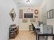 A well-lit home office with light walls and tiled floors, with a functional workspace at 15475 Camp Dubois Cres, Winter Garden, FL 34787