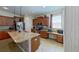 Spacious kitchen boasts granite countertops, stainless appliances, and ample cabinet space at 15475 Camp Dubois Cres, Winter Garden, FL 34787