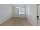 Unfurnished living room featuring neutral walls, a window with blinds, and tile flooring at 15475 Camp Dubois Cres, Winter Garden, FL 34787