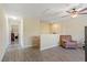 Neutral living room with wood floors and stair access to another level of the home at 15475 Camp Dubois Cres, Winter Garden, FL 34787