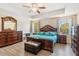 Spacious main bedroom features a tray ceiling, a ceiling fan, and lots of natural light at 15475 Camp Dubois Cres, Winter Garden, FL 34787