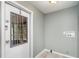 Mud room featuring a back door with a window and the hookups for a washer and dryer at 1638 Leesburg Blvd, Fruitland Park, FL 34731