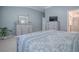 Relaxing primary bedroom with soft colors, ample storage, and an ensuite bathroom at 17714 Se 84Th Sheldon Ter, The Villages, FL 32162