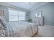 Well-lit bedroom featuring a large window and neutral decor at 17714 Se 84Th Sheldon Ter, The Villages, FL 32162