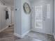 Elegant entryway features a decorative door, stylish flooring, and a unique wall decoration at 17714 Se 84Th Sheldon Ter, The Villages, FL 32162
