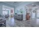 Open living space featuring modern floors and a partial view of the dining room and kitchen at 17714 Se 84Th Sheldon Ter, The Villages, FL 32162