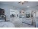 Open-concept living area with views to an office, kitchen, and front door at 17714 Se 84Th Sheldon Ter, The Villages, FL 32162