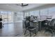 Well-lit office space with large windows, modern desk setup, and access to the patio at 17714 Se 84Th Sheldon Ter, The Villages, FL 32162
