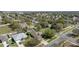 Neighborhood aerial view featuring well-maintained homes, mature trees, and manicured lawns at 1792 Presidio Dr, Clermont, FL 34711