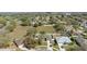 Aerial view of a charming home in a quiet neighborhood with green trees and well maintained lawns at 1792 Presidio Dr, Clermont, FL 34711
