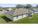 Aerial view of backyard with a patio set perfect for outdoor dining and entertaining at 1792 Presidio Dr, Clermont, FL 34711