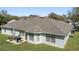 Large backyard with patio area for outdoor dining; natural light and trees abound at 1792 Presidio Dr, Clermont, FL 34711
