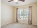 A comfortable bedroom with a ceiling fan, natural light, and neutral-toned walls at 1792 Presidio Dr, Clermont, FL 34711