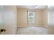 A bedroom with a ceiling fan, carpeted floor, and window with natural light at 1792 Presidio Dr, Clermont, FL 34711