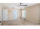 Bedroom featuring carpet, ceiling fan, and wall decor at 1792 Presidio Dr, Clermont, FL 34711